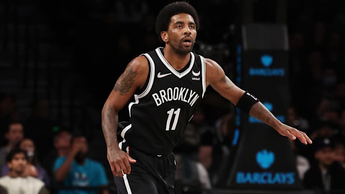 Brooklyn Nets guard Kyrie Irving (11) looks on against the Charlotte Hornets during the first quarter at Barclays Center.